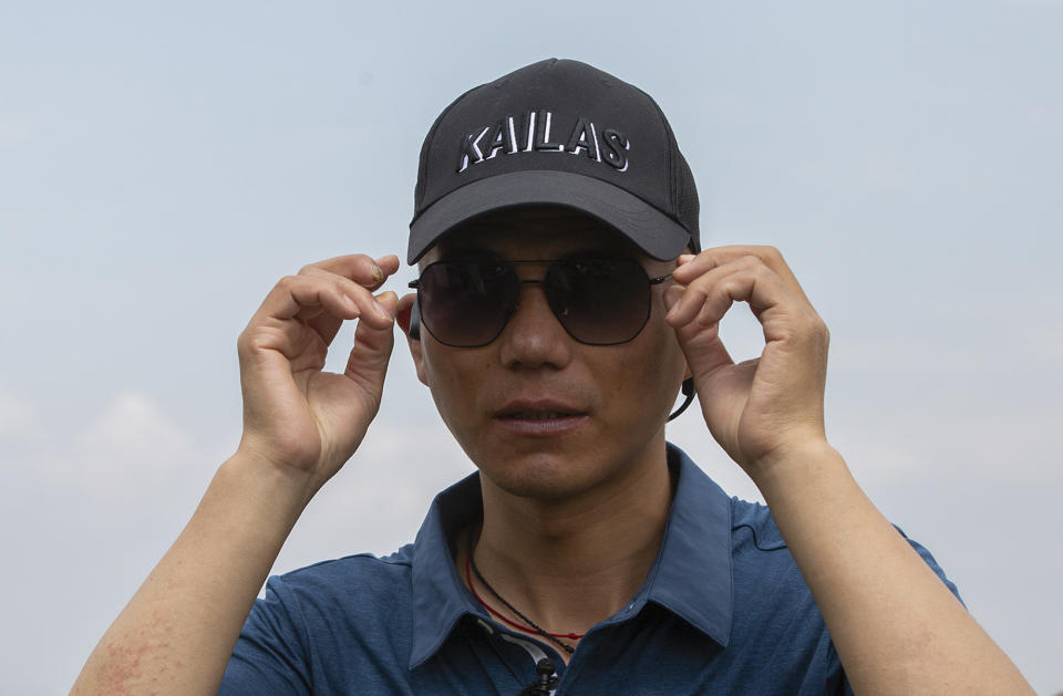 Chinese climber Zhang Hong, 44, who became the first blind Asian to scale Mount Everest upon return from the mountain sits during an interview with the Associated Press at a hotel in Kathmandu, Nepal, Monday, May 31, 2021.Zhang says he aims to climb the highest peaks on all seven continents and then travel to the North and South Poles. (AP Photos/Bikram Rai)