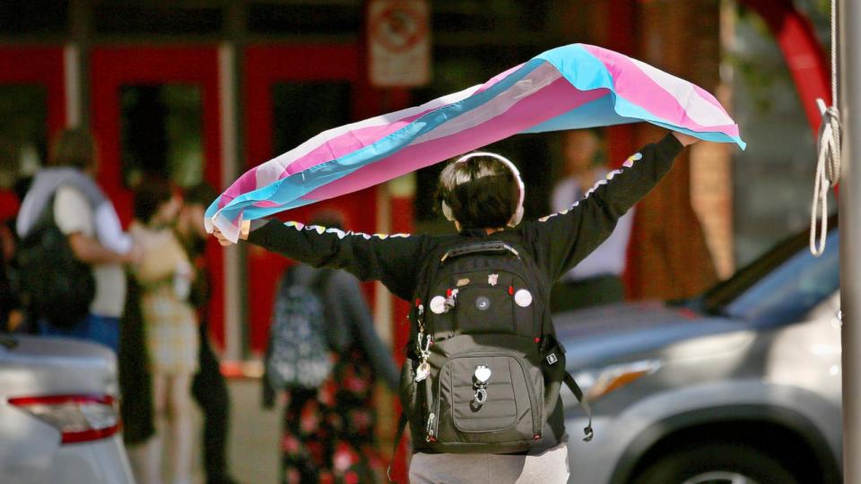 PHOTO: A Bayside High School student protests the governor's new transgender policies in front of the school on Feb. 13, 2024, in Virginia Beach, Virginia. (Virginian Pilot/TNS/Getty Images, FILE)