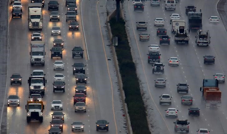 A weather system brings rain to traffic traveling on Interstate 5 past Solana Beach, California