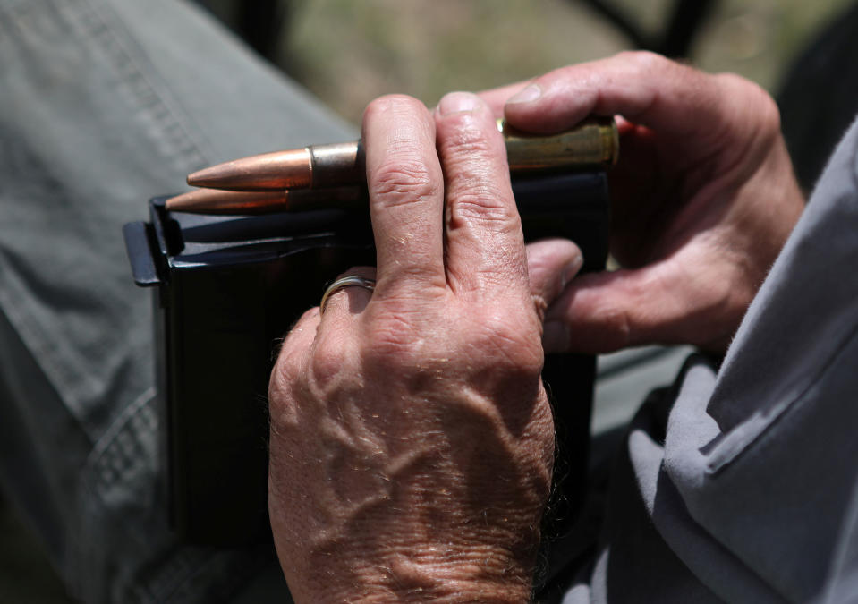 <p>A member of self-described patriot groups and militias prepares to shoot a .50 caliber rifle during III% United Patriots’ Field Training Exercise outside Fountain, Colo., July 29, 2017. (Photo: Jim Urquhart/Reuters) </p>