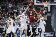 Temple's Shizz Alston Jr. (10) shoots against Belmont's Dylan Windler (3) and Kevin McClain (11) during the first half of a First Four game of the NCAA college basketball tournament, Tuesday, March 19, 2019, in Dayton, Ohio. (AP Photo/John Minchillo)