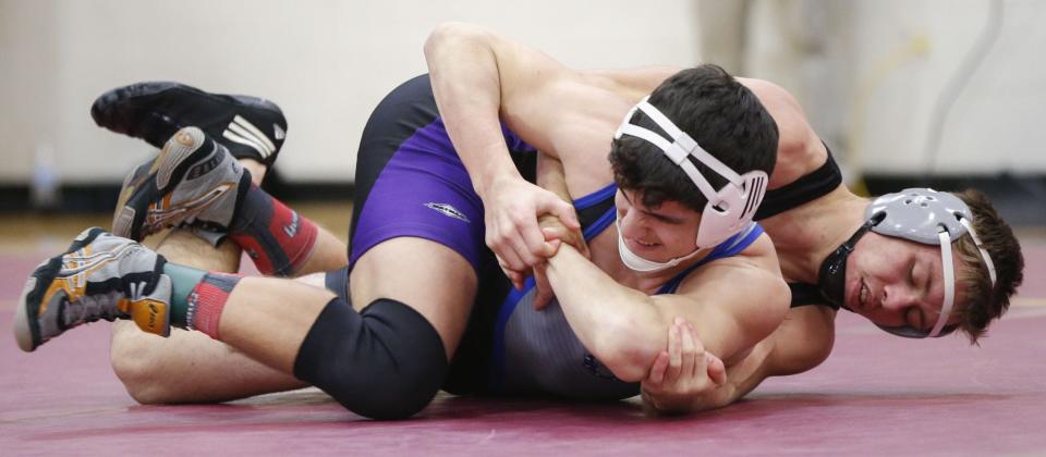 Bloomington South’s Derek Blubaugh (top) wrestles against Columbus North’s Nick Holt at 170 pounds in the Conference Indiana tournament at Bloomington North in January of 2018. Blubaugh went on to win the title.