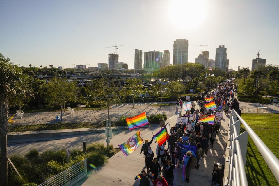 FILE - People march toward the St. Pete Pier in St. Petersburg, Fla., on March 12, 2022, during a protest against the controversial "Don't Say Gay" bill passed by Florida's Republican-led legislature. While Florida has received national attention for what opponents call the "Don't Say Gay" law, the trend is national, particularly in red states. The American Civil Liberties Union is tracking nearly 470 bills it considers to be anti-LGBTQ+, most of which are in states with Republican-controlled the Legislature, such as Texas, Missouri, Florida and Tennessee. (Martha Asencio-Rhine/Tampa Bay Times via AP, File)