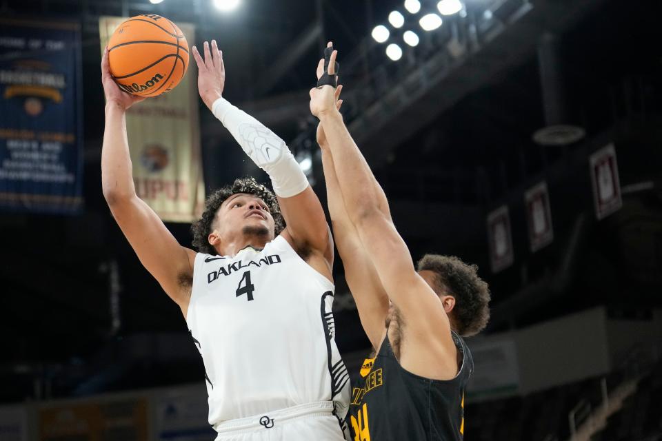 Oakland forward Trey Townsend (4) shoots over Milwaukee forward Darius Duffy during the first half of the Horizon League championship game at Indiana Farmers Coliseum in Indianapolis on Tuesday, March 12, 2024.