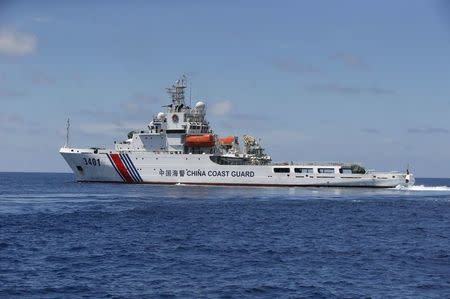 A Chinese Coast Guard vessel is pictured on the disputed Second Thomas Shoal, part of the Spratly Islands, in the South China Sea March 29, 2014. REUTERS/Erik De Castro