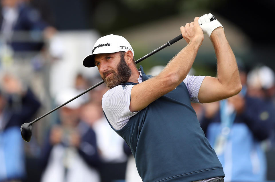 Seen here, Dustin Johnson tees off on the first tee during the US Open at The Country Club.