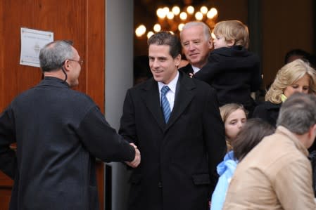 FILE PHOTO: U.S. Vice President Biden and his son Hunter Biden depart after a pre-inauguration church service in Washington