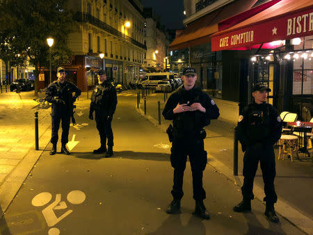 French police secure a street after a man killed a passer-by in a knife attack in the heart of Paris and injured four others before being shot dead by police, according to French authorities in Paris, France, May 12, 2018. REUTERS/Lucien Libert