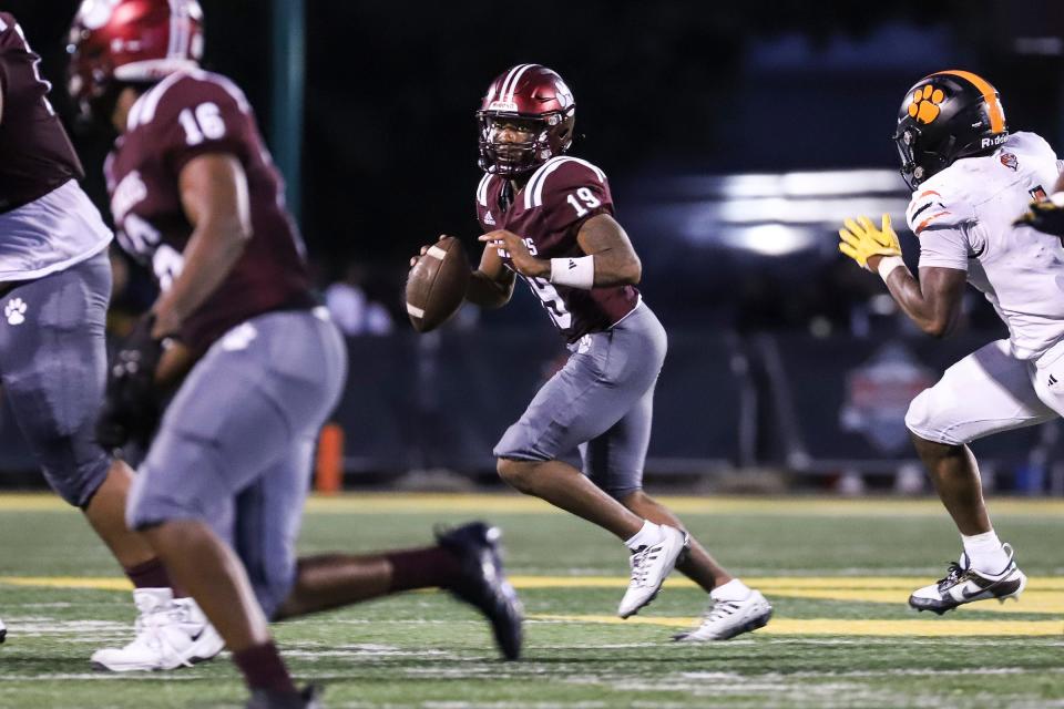 River Rouge quarterback Mckale McDowell (19) looks to pass against Belleville during the second half of Prep Kickoff Classic at Wayne State University's Tom Adams Field in Detroi on Friday, August 25, 2023.