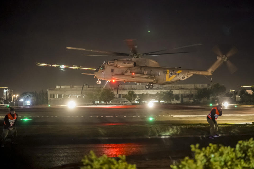 A helicopter carrying Israeli hostages released by Hamas lands at the Sheba Medical Center in Ramat Gan, Israel, early Thursday, Nov. 30, 2023. International mediators on Wednesday worked to extend the truce in Gaza, encouraging Hamas militants to keep freeing hostages in exchange for the release of Palestinian prisoners and further relief from Israel's air and ground offensive.(AP Photo/Leo Correa)