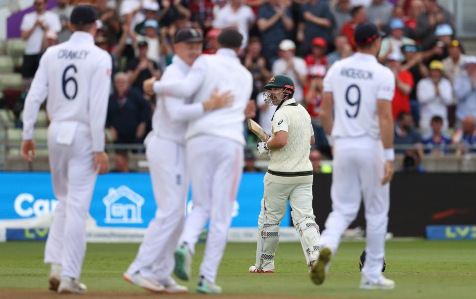 Travis Head of Australia looks dejected after being dismissed by Moeen Ali of England during Day Five