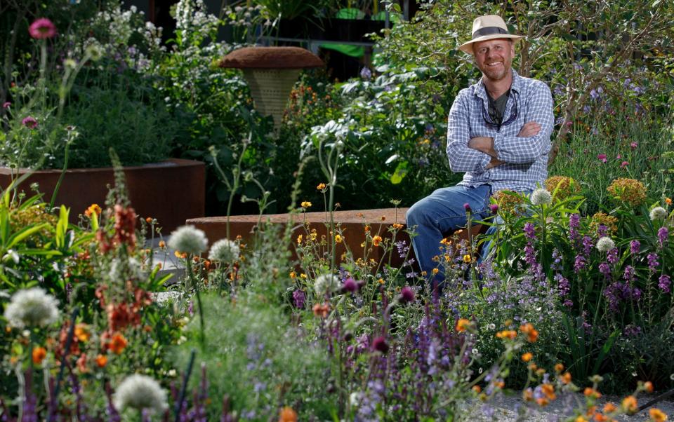 Joe Swift in the BBC Studios Our Green Planet and RHS Bee Garden he designed for the Chelsea Flower Show - Luke MacGregor/RHS/PA