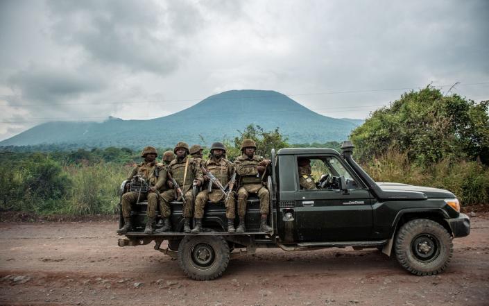 A Congolese army pick up carrying troops heads towards the front line in May 2022 - ARLETTE BASHIZI/AFP