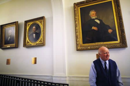 New Hampshire Secretary of State Bill Gardner stands in the hallway outside his office at the State House in Concord, New Hampshire December 17, 2014. REUTERS/Brian Snyder