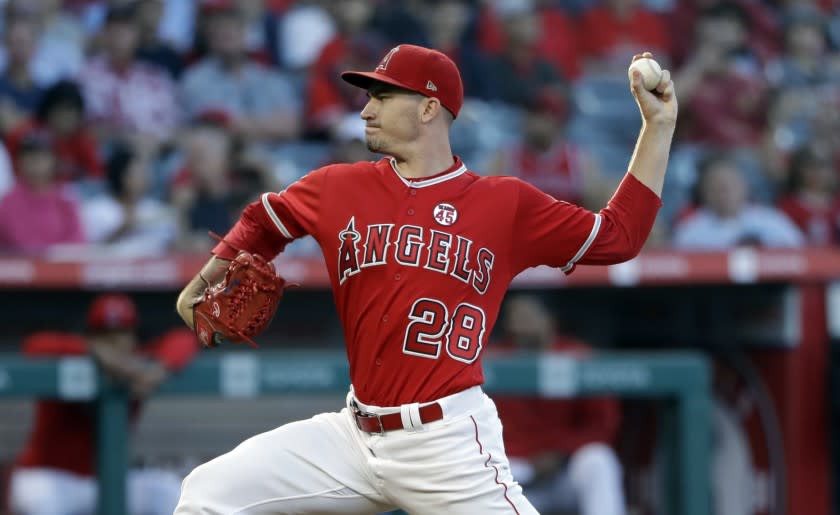 Los Angeles Angels starting pitcher Andrew Heaney throws to a Houston Astros batter during the first inning of a baseball game Tuesday, July 16, 2019, in Anaheim, Calif. (AP Photo/Marcio Jose Sanchez)