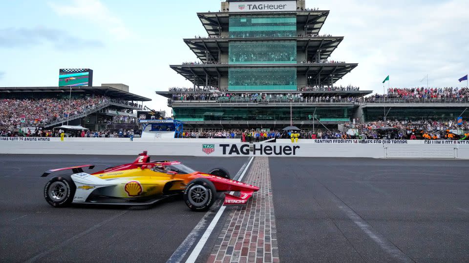 Josef Newgarden crosses the finish line to win the Indianapolis 500 Sunday. - AJ Mast/AP