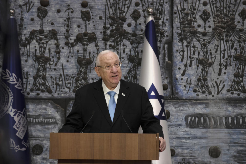 Israeli President Reuvin Rivlin makes remarks after receiving official election results from Chairman of Israel's Central Elections Committee Judge Uzi Fogelman in Jerusalem, Wednesday, March 31, 2021. Israeli election officials Wednesday handed the results of last week's vote to President Rivlin, nudging forward the country' elusive efforts to break political deadlock, form a government and avoid an unprecedented fifth consecutive round of balloting. (AP Photo/Maya Alleruzzo)