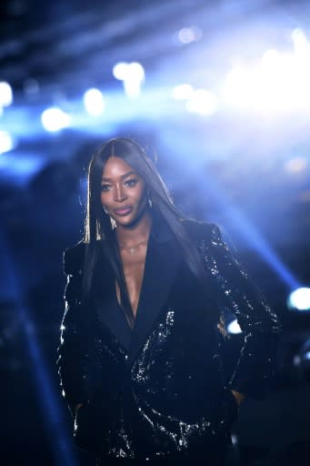 Naomi Campbell closed the Saint Laurent show with a glistening patent smoking