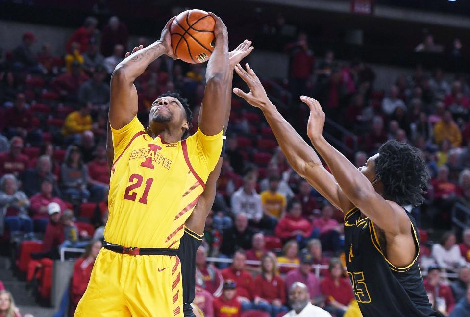 Iowa State's Osun Osunniyi takes a shot around North Carolina A&T's Webster Filmore during the first half of Sunday's game at Hilton Coliseum. Osunniyi scored 16 points in the victory.