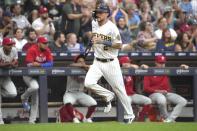 Milwaukee Brewers' Brice Turang (2) scores against the Philadelphia Phillies during the second inning of a baseball game Saturday, Sept. 2, 2023, in Milwaukee. (AP Photo/Kayla Wolf)