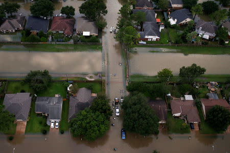 FILE PHOTO: Houses are seen partially submerged in flood waters caused by Tropical Storm Harvey in Northwest Houston, Texas, U.S., August 30, 2017. REUTERS/Adrees Latif/File Photo