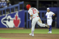 Los Angeles Angels' Mike Trout rounds the bases in front of Toronto Blue Jays shortstop Bo Bichette after his solo home run during the fifth inning of a baseball game Thursday, April 8, 2021, in Dunedin, Fla. (AP Photo/Mike Carlson)