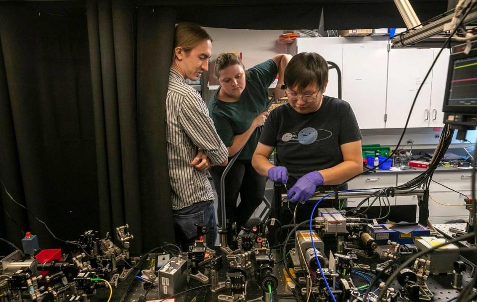 Duke Phd students connect multiple quantum computers at the Duke Quantum Center in August 2022.