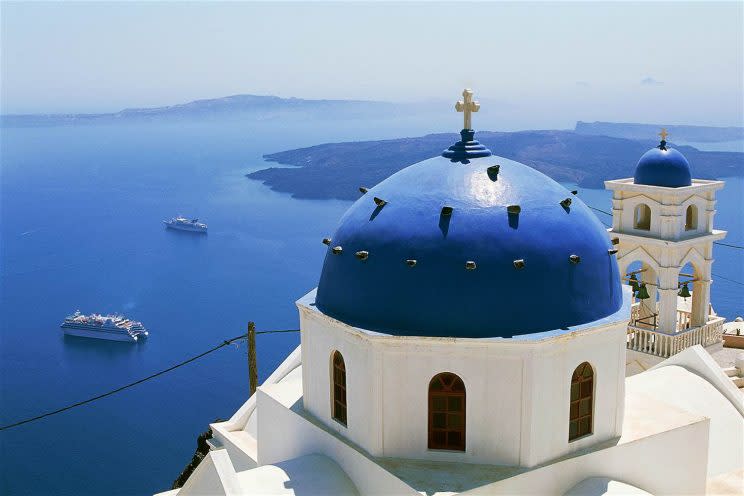 Santorini’s iconic white and blue buildings are nestled into the island’s landscapes [KWB PRODUCTIONS]