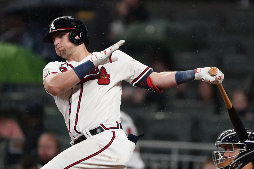 Atlanta Braves' Austin Riley follows through on a base hit during the fourth inning of the team's baseball game against the Colorado Rockies on Wednesday, Sept. 15, 2021, in Atlanta. (AP Photo/John Bazemore)