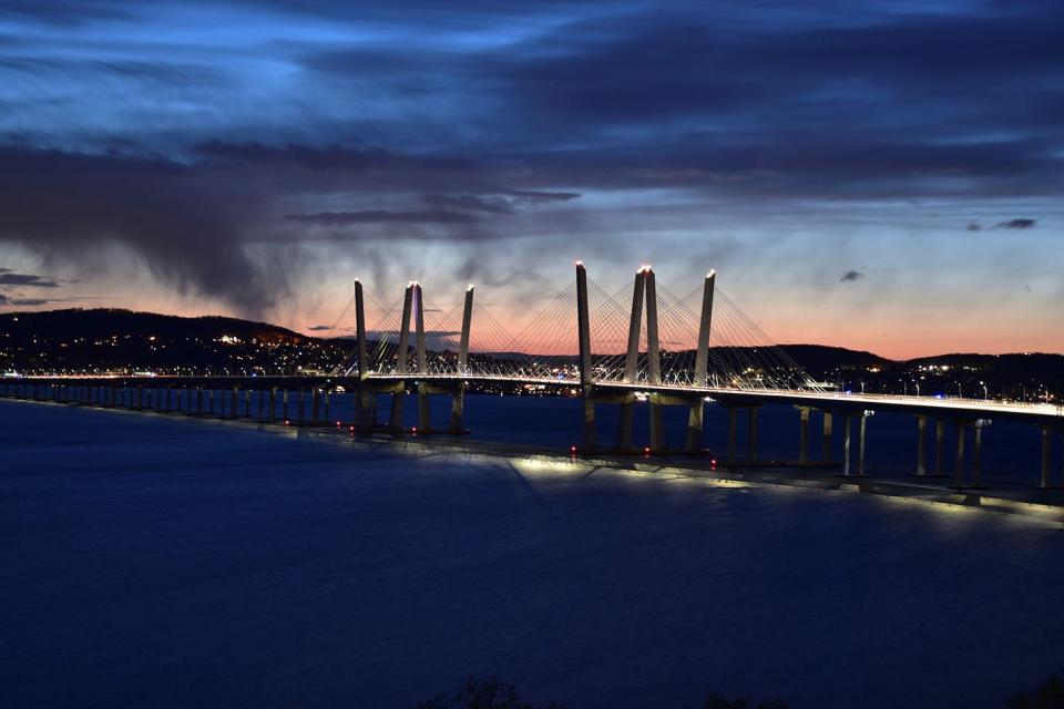 The Gov. Mario M. Cuomo Bridge's lighting scheme for Earth Day is muted, with just the roadway lit. Thousands of banks of LED fixtures line the twin-span bridge, making an infinite number of scenes possible, even one that's minimal.
