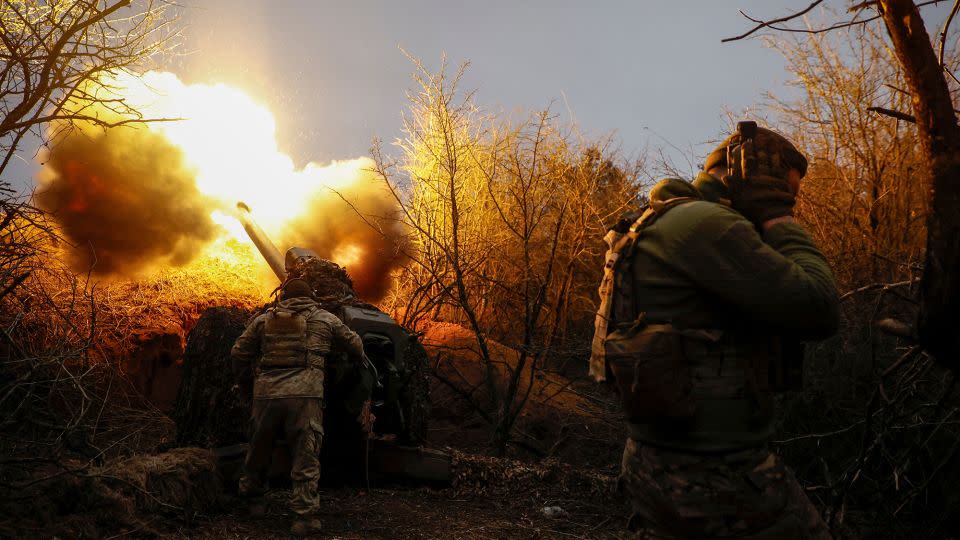 A Ukrainian servicemen fires a howitzer towards Russian troops in Kherson region, Ukraine, in March. - Serhii Nuzhnenko/Reuters