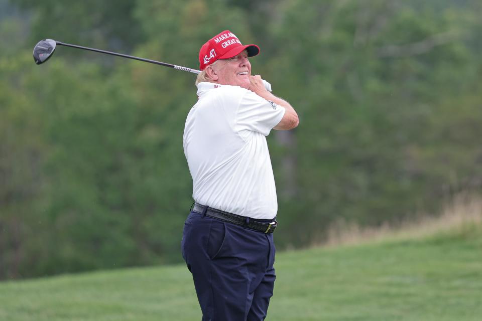 Former President Donald Trump hits a shot during the pro-am for the LIV Golf League event at Trump National Bedminster in New Jersey on Aug. 10.