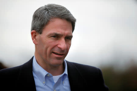 FILE PHOTO: Virginia Republican gubernatorial nominee Ken Cuccinelli talks with supporters at a polling place at Smith Station Elementary School in Spotsylvania, Virginia, U.S. November 5, 2013. REUTERS/Jonathan Ernst/File Photo