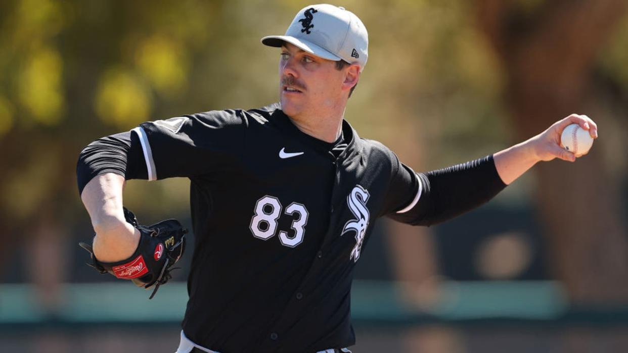 <div>GLENDALE, ARIZONA - FEBRUARY 21: Ky Bush #83 of the Chicago White Sox delivers a pitch during a live batting practice session during a spring training workout at Camelback Ranch on February 21, 2024 in Glendale, Arizona. (Photo by Michael Reaves/Getty Images)</div>