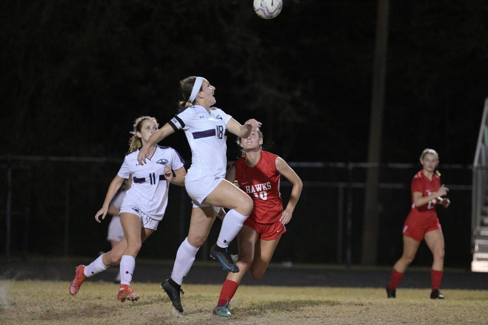 Dwyer's Samantha Long vies for possession facing up against her Seminole Ridge counterparts during the squads' district title game on Feb. 1, 2023.