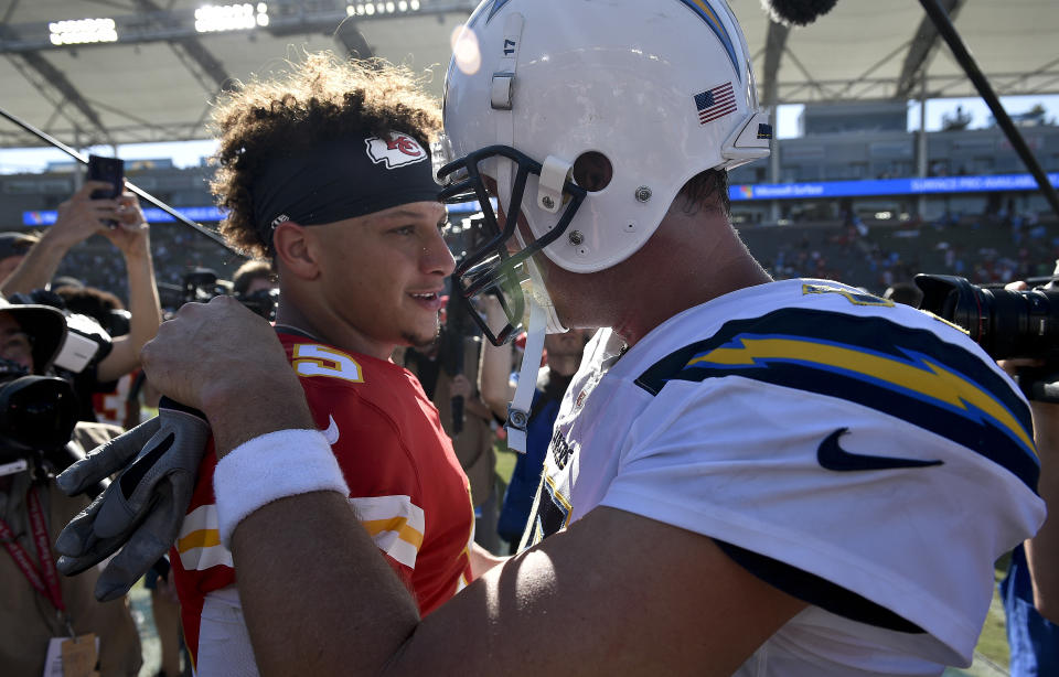 Chiefs QB Patrick Mahomes, sharing a word with Chargers QB Philip Rivers, had an impressive Week 1 performance against the Chargers. (AP)