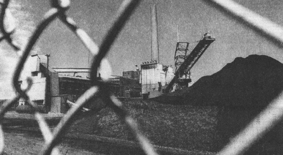 An environmentally battered Goudey Station appears behind the fence in the 1990's.