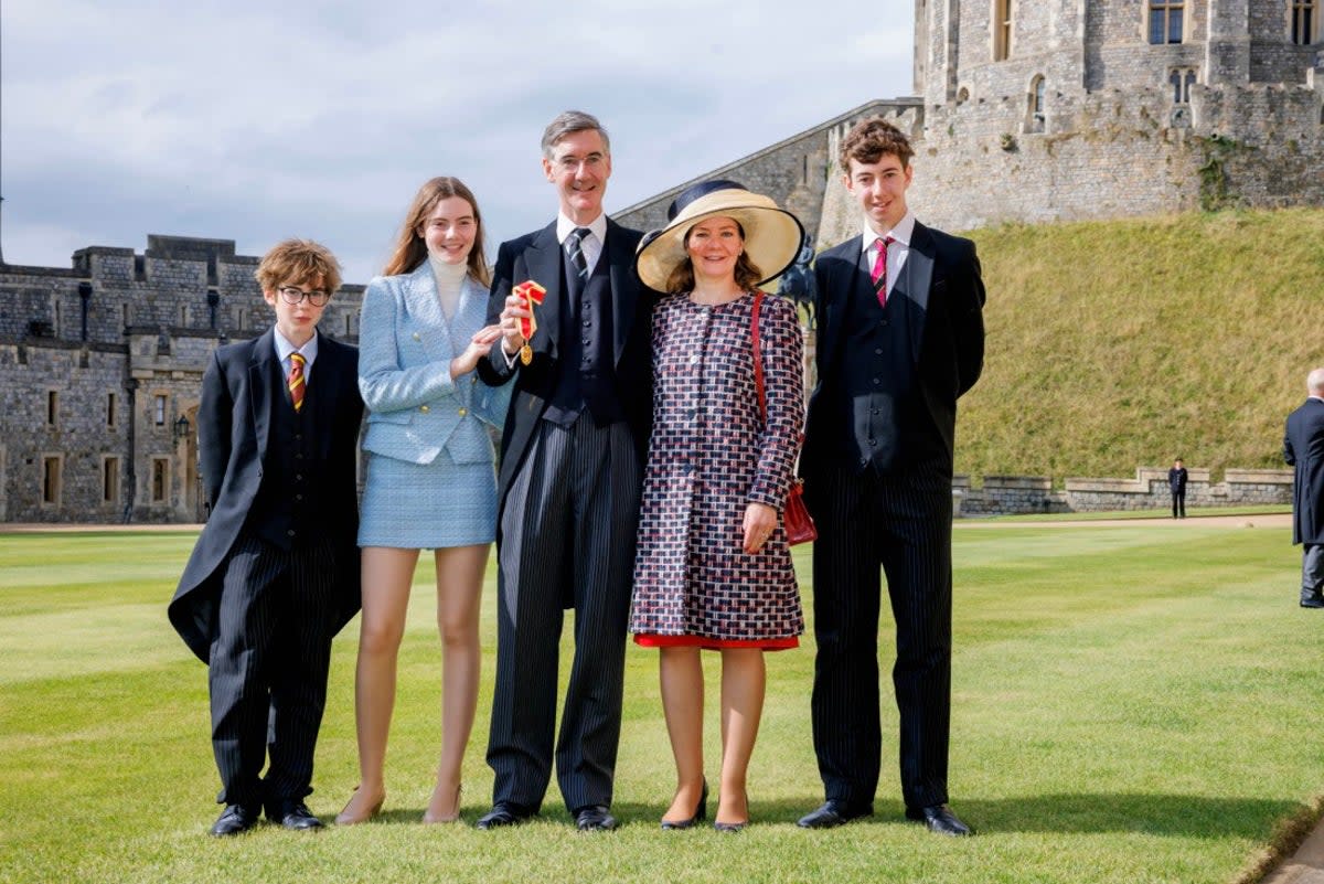 Jacob Rees-Mogg with his wife Helena, children Mary, Thomas (L) and Peter as he receives his Knighthood at Windsor Castle in 2023 (Getty Images)