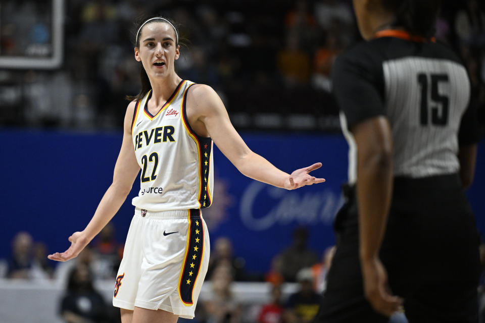 Indiana Fever guard Caitlin Clark (22) reacts during the first quarter of an WNBA basketball game against the Connecticut Sun, Tuesday, May 14, 2024, in Uncasville, Conn. (AP Photo/Jessica Hill)