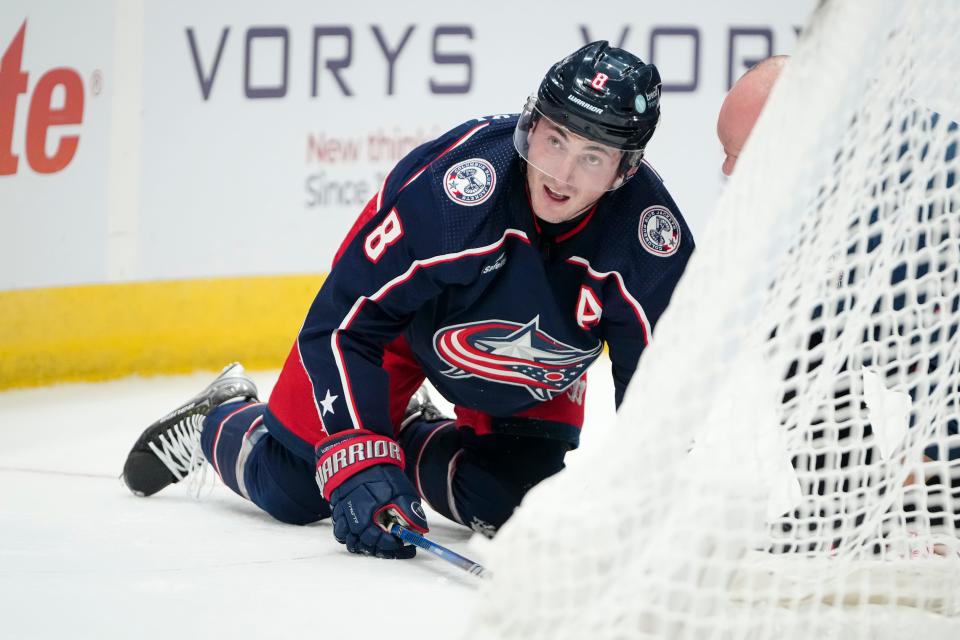 Oct 12, 2023; Columbus, Ohio, USA; Columbus Blue Jackets defenseman Zach Werenski (8) is tended to by training staff after a collision with Philadelphia Flyers right wing Garnet Hathaway (19) during the second period of the NHL hockey game at Nationwide Arena.
