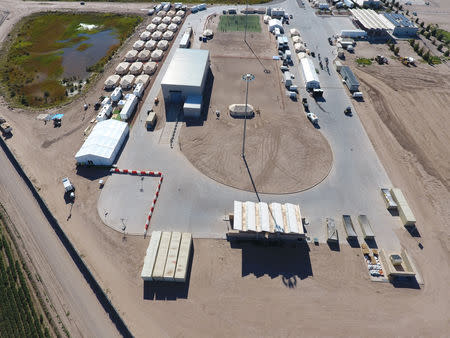 A tent city set up to hold immigrant children separated from their parents or who crossed the U.S. border on their own, is seen inTornillo, Texas, U.S., in this U.S. Department of Health and Human Services (HHS) image released on October 12, 2018. Courtesy HHS/Handout via REUTERS