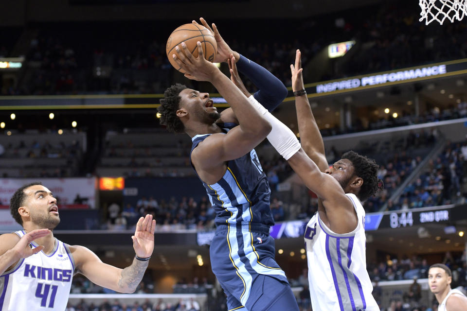 Memphis Grizzlies forward Jaren Jackson Jr. shoots against Sacramento Kings forward Chimezie Metu in the first half of an NBA basketball game, Tuesday, Nov. 22, 2022, in Memphis, Tenn. (AP Photo/Brandon Dill)