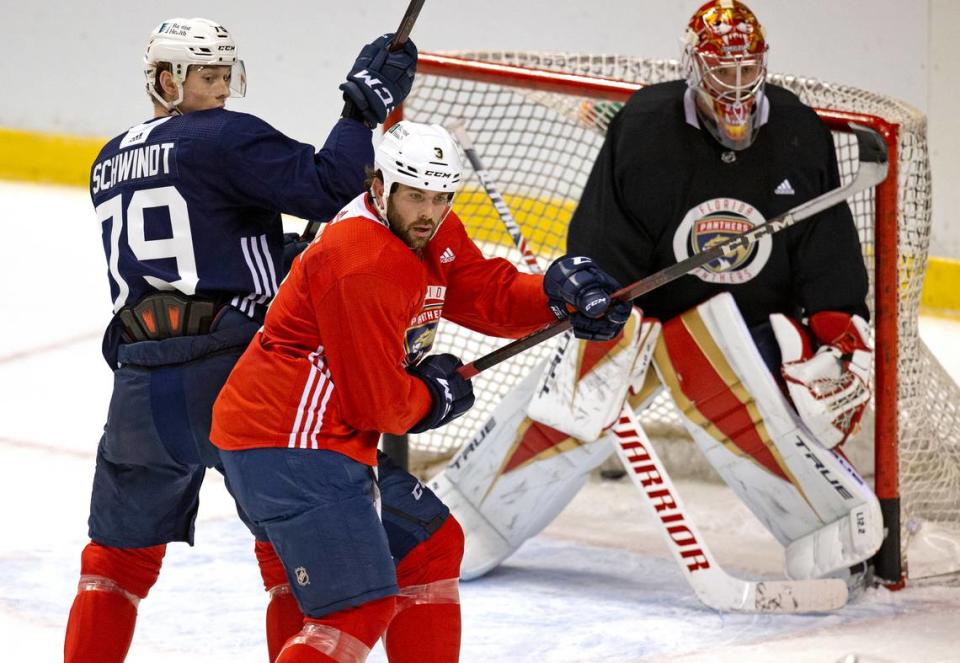 Florida Panthers defenseman Keith Yandle (3) and Panthers goalie Philippe Desrosiers (30) defend the goal from Panthers center Cole Schwindt (79) during training camp in preparation for the 2021 NHL season at the BB&T Center on Sunday, January 10, 2021 in Sunrise.