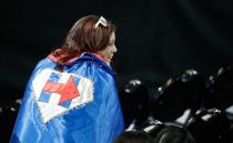 A supporter wearing a cape watches Democratic presidential nominee Hillary Clinton's election night rally in NYC. Photo: AP