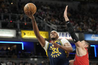 Indiana Pacers center Myles Turner (33) shoots against Chicago Bulls center Nikola Vucevic during the first half of an NBA basketball game in Indianapolis, Wednesday, March 13, 2024. (AP Photo/AJ Mast)