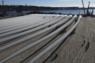 Wind turbine blades for South Fork Wind, an offshore wind farm, are stored at State Pier in New London, Conn., Monday, Dec. 4, 2023. (AP Photo/Ted Shaffrey)