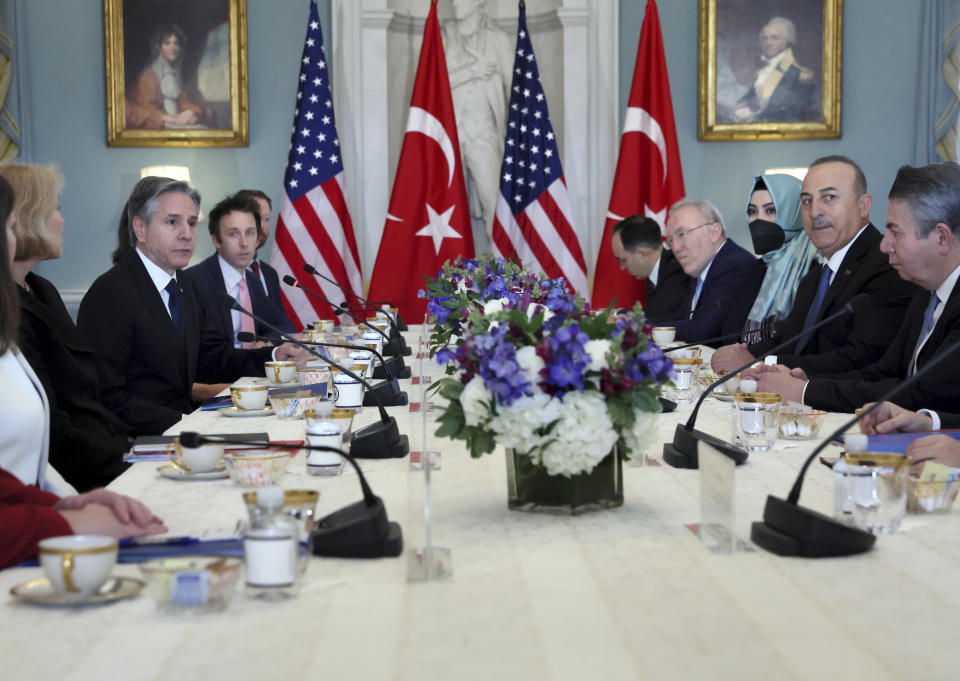 U.S. Secretary of State Antony Blinken and Turkey's Foreign Minister Mevlut Cavusoglu meet at the State Department in Washington, Wednesday, Jan. 18, 2023. (Leah Millis/Pool via AP)