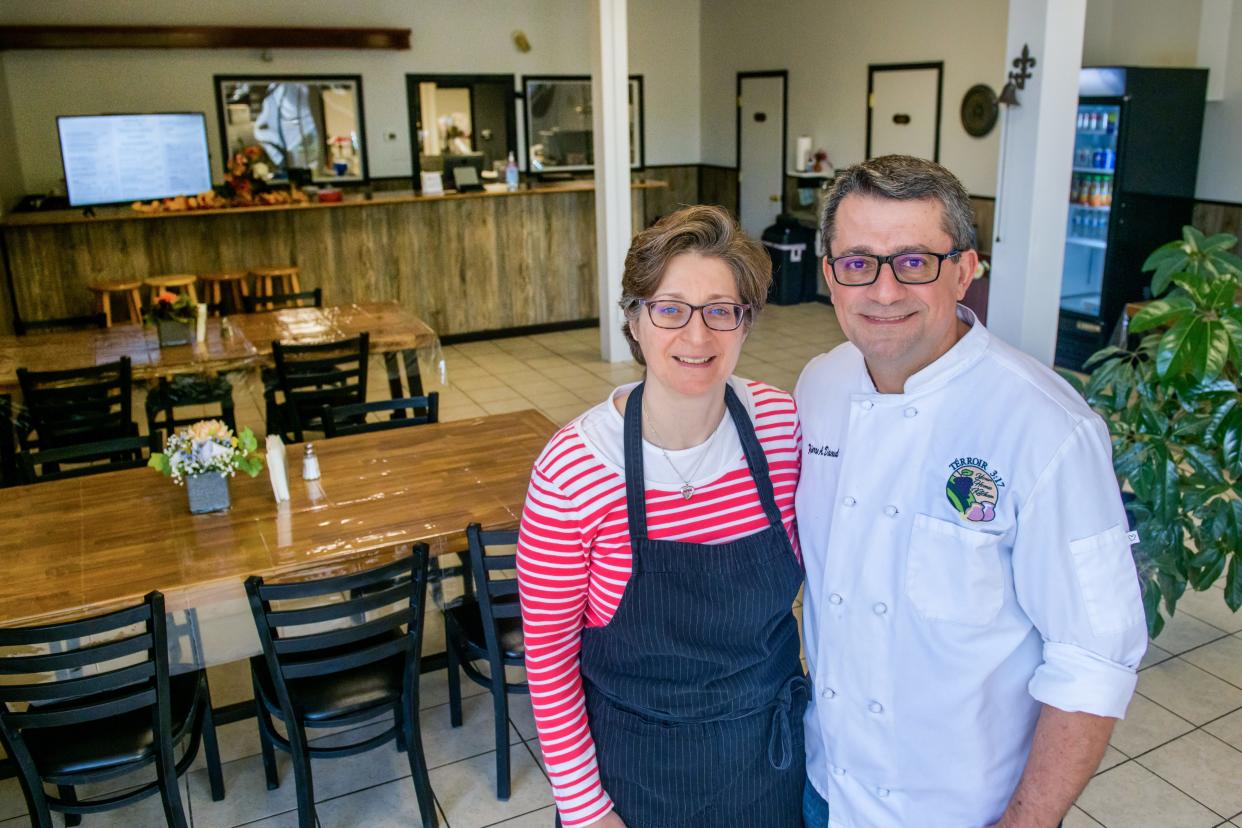 Pierre and Scarlet Daoud pose in their new Mediterranean restaurant Terroir 3:17 Your Home Kitchen at 128 N. Davenport Street on the square in Metamora.