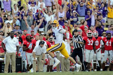 Oct 13, 2018; Baton Rouge, LA, USA; LSU Tigers quarterback Joe Burrow (9) breaks away on a run against the Georgia Bulldogs during the fourth quarter at Tiger Stadium. LSU defeated Georgia 36-16. Mandatory Credit: Derick E. Hingle-USA TODAY Sports