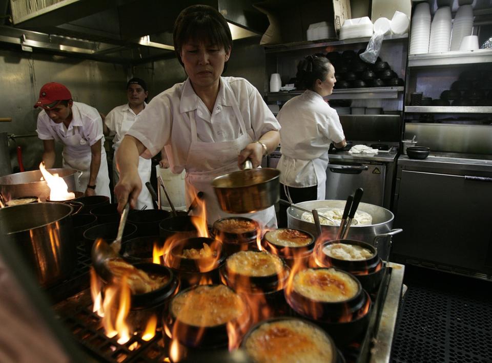 Food is prepared in the kitchen of the Wilshire Boulevard BCD Tofu House.